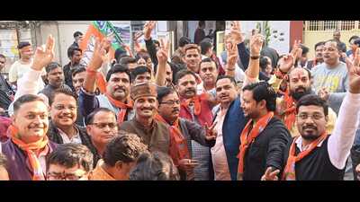 Party workers celebrate the BJP’s victory in assembly elections at three states, in Varanasi on Sunday (Sourced)