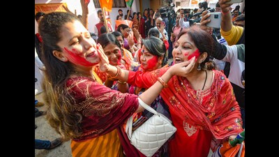 BJP workers celebrate the party's victory in Madhya Pradesh, Rajasthan and Chhattisgarh on Sunday. (PTI) BJP workers celebrate the party's victory in Madhya Pradesh, Rajasthan and Chhattisgarh on Sunday. (PTI)