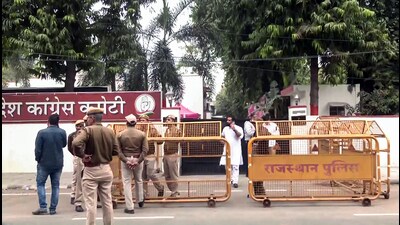 Police personnel stand guard outside the Congress office during the counting of votes for the Rajasthan assembly elections, in Jaipur on Sunday (ANI) Police personnel stand guard outside the Congress office during the counting of votes for the Rajasthan assembly elections, in Jaipur on Sunday (ANI)