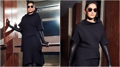 While Sonam's black ribbed blouse features half-length sleeves, an ill-fitted silhouette, an asymmetric hemline, and a bateau neckline, the skirt has midi length, ribbed design, asymmetric hem, and a relaxed fitting. She styled with thigh-high black boots featuring killer high heels and matching full-sleeved leather fingerless gloves. (Instagram) While Sonam's black ribbed blouse features half-length sleeves, an ill-fitted silhouette, an asymmetric hemline, and a bateau neckline, the skirt has midi length, ribbed design, asymmetric hem, and a relaxed fitting. She styled with thigh-high black boots featuring killer high heels and matching full-sleeved leather fingerless gloves. (Instagram)
