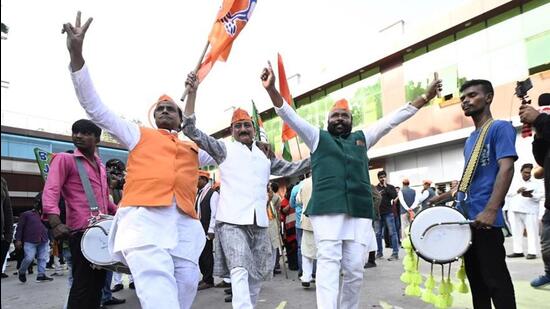 BJP workers in Lucknow celebrate the party’s win in three states. (Deepak Gupta/HT Photo)