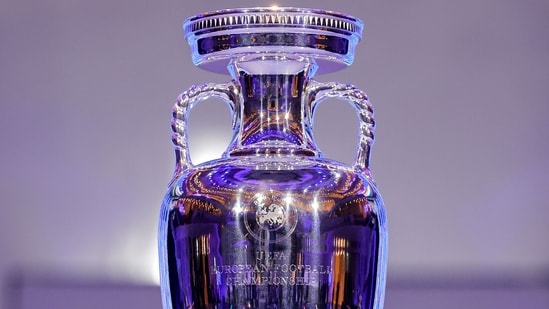 The trophy is pictured after the final draw for the UEFA Euro 2024 European Championship football competition in Hamburg (AFP)