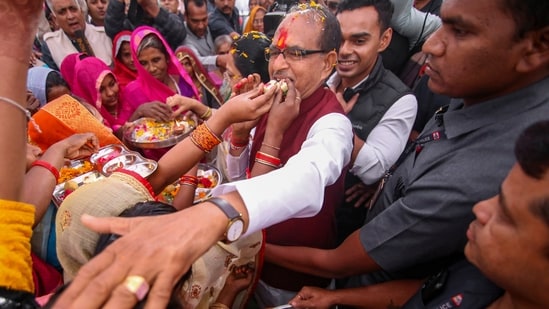 Madhya Pradesh Chief Minister Shivraj Singh Chouhan celebrating his win with his supporters at Jait village in Sehore district. Madhya Pradesh Chief Minister Shivraj Singh Chouhan celebrating his win with his supporters at Jait village in Sehore district.