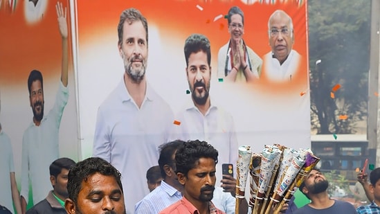 Congress workers burn firecrackers outside the party office to celebrate the party's lead during counting of votes for Telangana Assembly elections Congress workers burn firecrackers outside the party office to celebrate the party's lead during counting of votes for Telangana Assembly elections