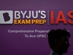 A man walks past an advertising hoarding of Byju's, an Education Technology company and one of India's biggest startup, outside one of its branches in New Delhi