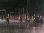 Police personnel on a road during heavy rain owing to Cyclone Michaung in Chennai on Sunday. Police personnel on a road during heavy rain owing to Cyclone Michaung in Chennai on Sunday.