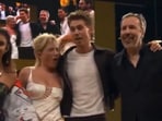 A video shared on social media shows an unknown object suddenly striking Florence while she posed for photos on stage with co-stars including Zendaya, Timothée Chalamet and Austin Butler (X)