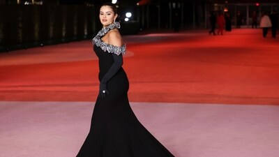 Selena Gomez made heads turn at the Academy Museum Gala in a floor-length evening gown by Valentino. Styled with metal roses-adorned neckline, Opera gloves, a diamond bracelet, matching earrings, and a statement ring, Selena stole the spotlight at the event.&nbsp; (REUTERS)