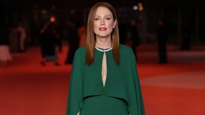 Julianne Moore chose an emerald green gown for the red carpet event. Her dress features a keyhole cut-out on the front and cape-like sleeves reaching to the floor. She wore the ensemble with a necklace, ear studs, rings, deep red lip shade, and a glowing blushed base.&nbsp; (REUTERS)