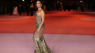 Eva Longoria attended the third Annual Academy Museum Gala in Los Angeles, dressed in a gold shimmering floor-length strapless gown. She styled the Dolce &amp; Gabbana look with hoops, rings, a side-parted bob, and a nude lip gloss.&nbsp; (REUTERS)