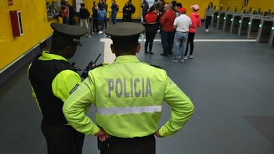 Policemen stand guard at one of the stations of Quito's Metro Line 1, during its first day of operation in Quito on December 1, 2023. . (Photo by Rodrigo Buendia / AFP) (AFP) Policemen stand guard at one of the stations of Quito's Metro Line 1, during its first day of operation in Quito on December 1, 2023. . (Photo by Rodrigo Buendia / AFP) (AFP)