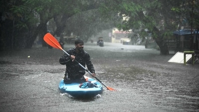 A man uses a kayak to cross a flooded street after heavy rains in Chennai on December 4, 2023. Cyclone Michuang is expected to make landfall on December 5 along the southern coast. (AFP) A man uses a kayak to cross a flooded street after heavy rains in Chennai on December 4, 2023. Cyclone Michuang is expected to make landfall on December 5 along the southern coast. (AFP)