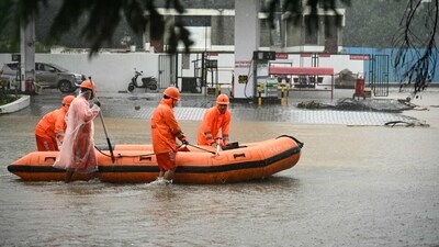 National Disaster Response Force (NDRF) personnel wade through a flooded street, during a rescue operation to help trapped civilians following heavy rainfall in Chennai on December 4, 2023. (AFP) National Disaster Response Force (NDRF) personnel wade through a flooded street, during a rescue operation to help trapped civilians following heavy rainfall in Chennai on December 4, 2023. (AFP)