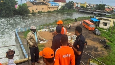 NDRF personnel visit a low-lying area near the banks of Kosasthalaiyar river as Tamil Nadu witnesses heavy rain owing to Cyclone Michaung, in Tiruvallur district. (PTI Photo) NDRF personnel visit a low-lying area near the banks of Kosasthalaiyar river as Tamil Nadu witnesses heavy rain owing to Cyclone Michaung, in Tiruvallur district. (PTI Photo)