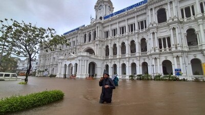 A man wades through a waterlogged road outside Ripon Building during heavy rain owing to Cyclone Michaung, in Chennai, Monday, Dec. 4, 2023. (PTI) A man wades through a waterlogged road outside Ripon Building during heavy rain owing to Cyclone Michaung, in Chennai, Monday, Dec. 4, 2023. (PTI)
