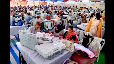 Polling officials collect EVMs and other polling materials on the eve of the Telangana Assembly election, at a distribution centre in Hyderabad, Wednesday, Nov. 29, 2023. (PTI) Polling officials collect EVMs and other polling materials on the eve of the Telangana Assembly election, at a distribution centre in Hyderabad, Wednesday, Nov. 29, 2023. (PTI)