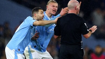 Manchester City's Erling Braut Haaland and Mateo Kovacic remonstrate with referee Simon Hooper (Reuters)