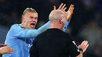 Manchester City's Erling Braut Haaland remonstrates with referee Simon Hooper. (Action Images via Reuters)