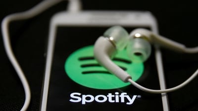 FILE PHOTO: Earphones are seen on top of a smart phone with a Spotify logo on it, in Zenica February 20, 2014. REUTERS/Dado Ruvic/File Photo (REUTERS)