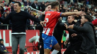Girona's Spanish coach Michel (L) and players celebrate Uruguayan forward #07 Cristhian Stuani's second goal during the La Liga match against Valencia CF. (AFP) Girona's Spanish coach Michel (L) and players celebrate Uruguayan forward #07 Cristhian Stuani's second goal during the La Liga match against Valencia CF. (AFP)