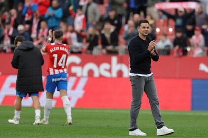 Girona's Spanish coach Michel (R) and players celebrate at the end of the La Liga match against Valencia CF at the Montilivi stadium. (AFP) Girona's Spanish coach Michel (R) and players celebrate at the end of the La Liga match against Valencia CF at the Montilivi stadium. (AFP)