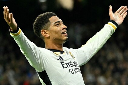 Jude Bellingham celebrates scoring his team's second goal during the UEFA Champions League first round group C football match between Real Madrid CF and SSC Naples at the Santiago Bernabeu stadium. (AFP) Jude Bellingham celebrates scoring his team's second goal during the UEFA Champions League first round group C football match between Real Madrid CF and SSC Naples at the Santiago Bernabeu stadium. (AFP)