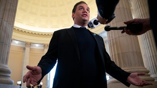 Former US Representative George Santos, a Republican from New York, speaks with members of the media on Capitol Hill in Washington, DC, US, on Friday, Dec. 1, 2023. T Photographer: Al Drago/Bloomberg (Bloomberg)