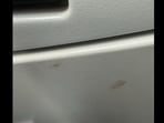 Blood stains the seat of a flight. 