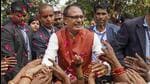 Shivraj Singh Chouhan celebrates the party's victory with BJP workers and supporters in Bhopal. (PTI Photo)