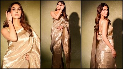 Vaani Kapoor is here to show you how to ace the traditional saree look with the utmost grace and flair. Vaani is a total stunner who can pull off any look to perfection, be it a casual dress or a chic pantsuit. The actress is quite active on social media and her Insta-diaries filled with fashion-forward looks are a treasure trove of style inspiration for all her followers. Her latest look, warped in a six-yards of grace, is no exception and is sure to steal your heart. With the wedding season upon us, Vaani's golden saree look serves as the perfect ethnic outfit inspiration. (Instagram/@ _vaanikapoor_) Vaani Kapoor is here to show you how to ace the traditional saree look with the utmost grace and flair. Vaani is a total stunner who can pull off any look to perfection, be it a casual dress or a chic pantsuit. The actress is quite active on social media and her Insta-diaries filled with fashion-forward looks are a treasure trove of style inspiration for all her followers. Her latest look, warped in a six-yards of grace, is no exception and is sure to steal your heart. With the wedding season upon us, Vaani's golden saree look serves as the perfect ethnic outfit inspiration. (Instagram/@ _vaanikapoor_)