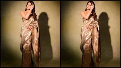 Vaani's saree comes in an enchanting shade of gold and is made of luxurious Kanjeevaram silk. She draped it elegantly around her with her pallu falling gracefully from her shoulder. She paired it with a matching sleeveless blouse. (Instagram/@ _vaanikapoor_) Vaani's saree comes in an enchanting shade of gold and is made of luxurious Kanjeevaram silk. She draped it elegantly around her with her pallu falling gracefully from her shoulder. She paired it with a matching sleeveless blouse. (Instagram/@ _vaanikapoor_)