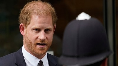 Prince Harry leaves the High Court after giving evidence in London. (AP) Prince Harry leaves the High Court after giving evidence in London. (AP)