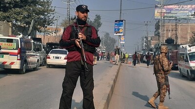 Police and army soldiers cordon off an area following a bomb explosion, in Peshawar, Pakistan, Tuesday. (AP)