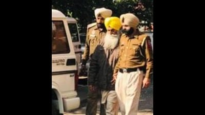 Paramjit Singh in police custody. (HT photo) Paramjit Singh in police custody. (HT photo)