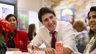 Prime Minister Justin Trudeau meets with local women leaders to discuss affordability and child care, at the Royal Rose Art Gallery & Gifts, in Aurora, Ontario, on Friday. (AP)