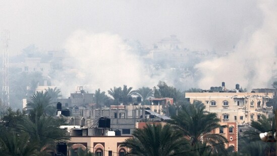 Israel-Hamas War: Smoke rises above buildings in Khan Yunis in the southern Gaza Strip, as battles between Israel and Hamas. (AFP)