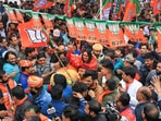 BJP candidate Balmukund Acharya arrives at party office after his victory in Rajasthan Assembly elections, in Jaipur. (PTI)
