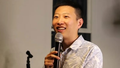 In this photo provided by Rena Gao, Xi Diao, a Chinese-born Australian civil engineer, performs standup comedy at a restaurant in Melbourne (AP) In this photo provided by Rena Gao, Xi Diao, a Chinese-born Australian civil engineer, performs standup comedy at a restaurant in Melbourne (AP)