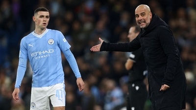 Manchester City's Phil Foden (L) listens to Manchester City's Spanish manager Pep Guardiola during the UEFA Champions League Group B second leg match (AFP) Manchester City's Phil Foden (L) listens to Manchester City's Spanish manager Pep Guardiola during the UEFA Champions League Group B second leg match (AFP)
