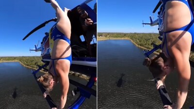 The image shows a woman doing a handstand on a flying helicopter. (Instagram/@ellietsmart) The image shows a woman doing a handstand on a flying helicopter. (Instagram/@ellietsmart)