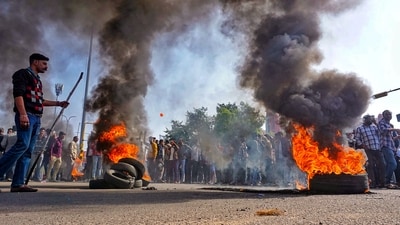 Jaipur: Rashtriya Rajput Karni Sena supporters burn tyres during a protest over the killing of their leader Sukhdev Singh Gogamedi, outside the Metro Mas Hospital in Jaipur. (PTI) Jaipur: Rashtriya Rajput Karni Sena supporters burn tyres during a protest over the killing of their leader Sukhdev Singh Gogamedi, outside the Metro Mas Hospital in Jaipur. (PTI)
