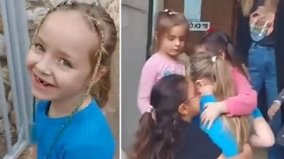 A heartwarming video has revealed the moment Emelia Aloni is mobbed by her overjoyed classmates on her first day back at school after being released by Hamas (@YosephHaddad/X)