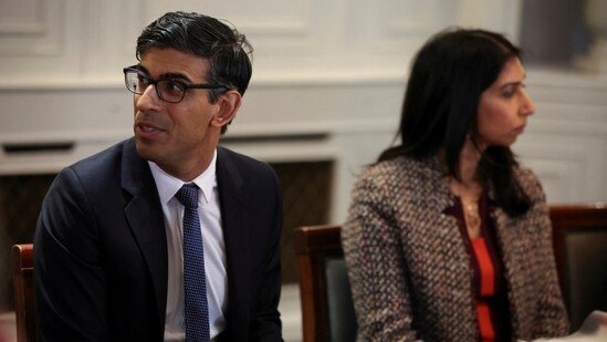 Britain's Prime Minister Rishi Sunak, left, and Britain's Home Secretary Suella Braverman, attend a meeting. (AP)