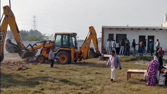 The land measuring around 11.7 hectares, falls in Tappal area of Aligarh district along the Yamuna Expressway, bordering Jewar. Several constructions, including offices, were being carried out on the land illegally, said officials. (HT Photo)