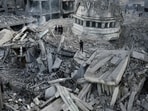 Palestinians inspect rubble after Israeli airstrikes hit a mosque in Gaza. (AP) Palestinians inspect rubble after Israeli airstrikes hit a mosque in Gaza. (AP)