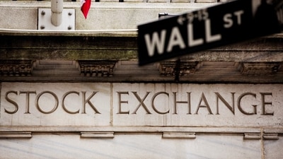 FILE PHOTO: A street sign for Wall Street hangs in front of the New York Stock Exchange May 8, 2013. REUTERS/Lucas Jackson/File Photo (REUTERS)