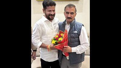 Himachal Pradesh chief minister Sukhvinder Singh Sukhu being greeted by Telangana chief minister Revanth Reddy as he arrives to attend the latter's swearing-in ceremony in Hyderabad on Thursday. (HT Photo)