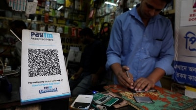 A QR code of Paytm is seen at a mobile repairing shop in Kolkata. (Reuters)