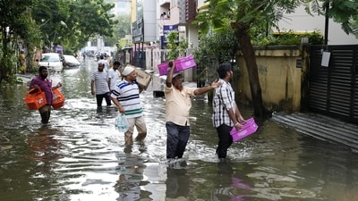 Volunteers distribute food amid floods after heavy rainfall in the aftermath of Cyclone Michaung, in Chennai. (PTI) Volunteers distribute food amid floods after heavy rainfall in the aftermath of Cyclone Michaung, in Chennai. (PTI)