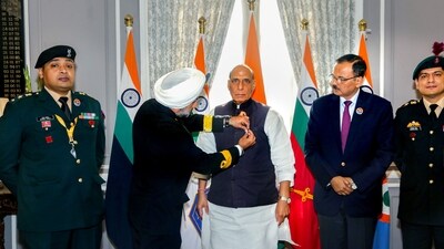 Union Defence Minister Rajnath Singh being felicitated with a badge by the Secretary, Kendriya Sainik Board Commodore HP Singh on the occasion of Armed Forces Flag Day in New Delhi. (PTI) Union Defence Minister Rajnath Singh being felicitated with a badge by the Secretary, Kendriya Sainik Board Commodore HP Singh on the occasion of Armed Forces Flag Day in New Delhi. (PTI)
